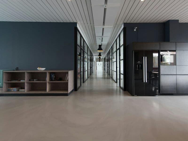 Long open-plan space with polished concrete floors
